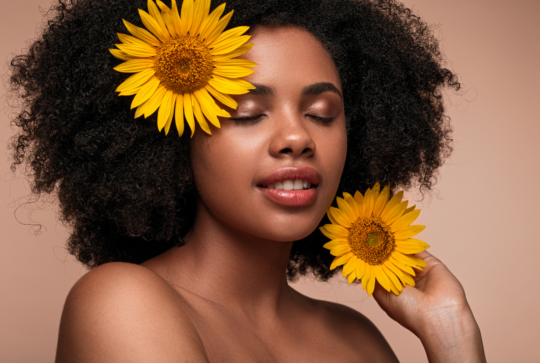 Black woman with sunflowers in hair